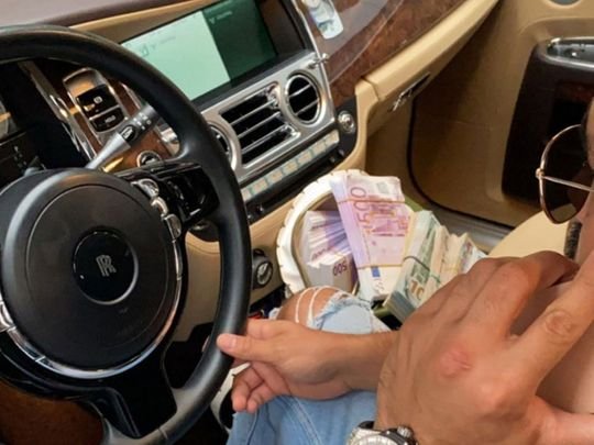 Dubai man throws fake cash from car in viral video; jailed, fined Dh200,000